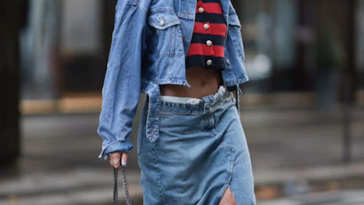 Two mint chocolate milkshakes with whipped cream and green sprinkles.