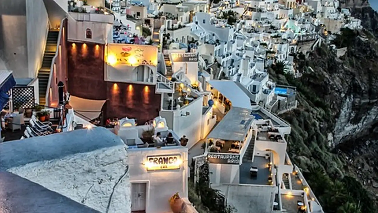 blue bowl of black bean beef tortilla soup on a board with cilantro and shredded cheese in background